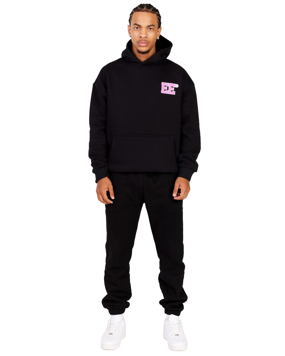 Male model wearing a black hoodie with a pink 'EE' Logo on the chest