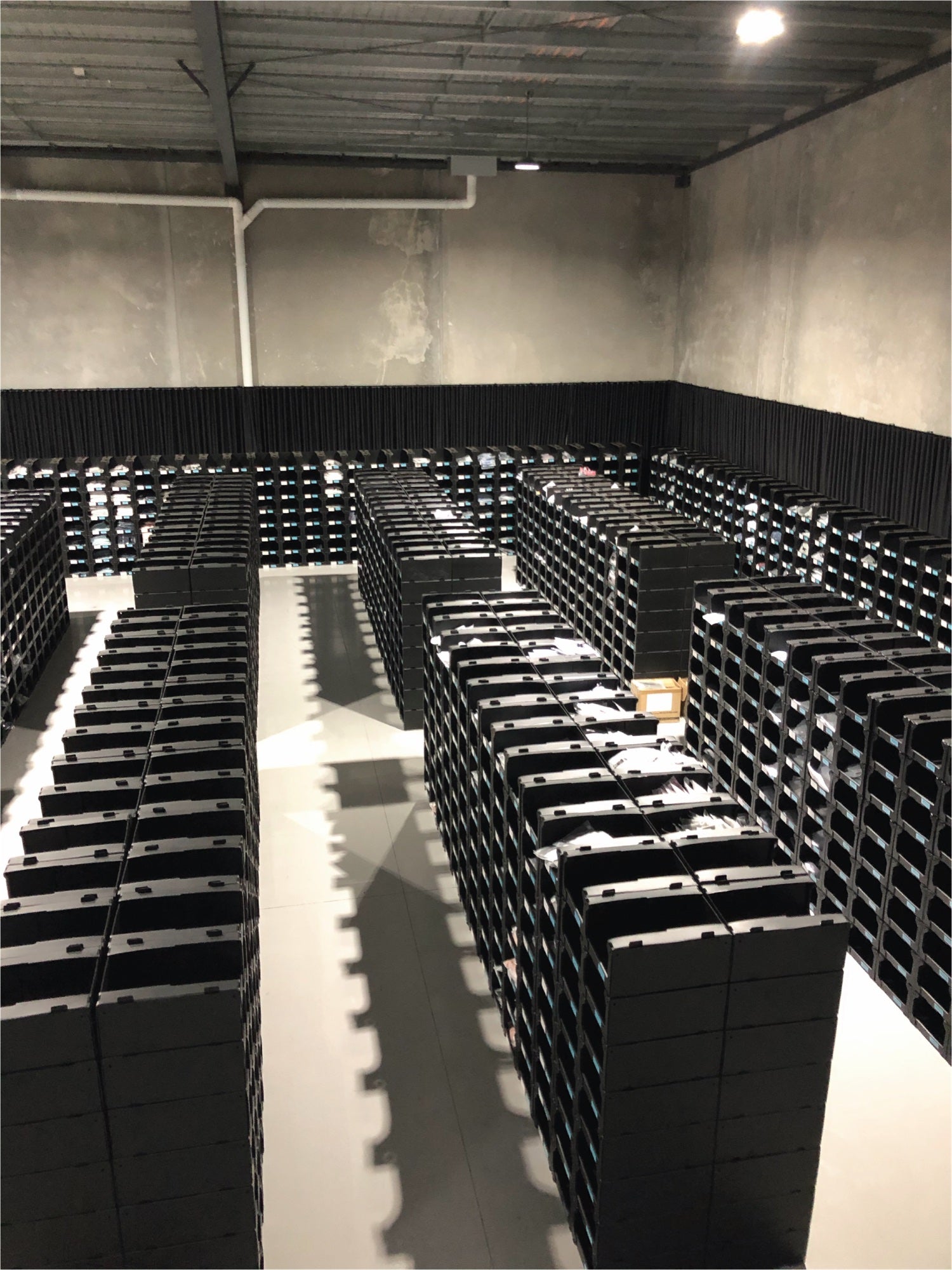 Rows of shoes in the Elite Eleven warehouse
